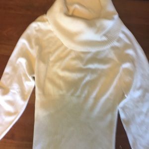 A beautiful cream colored sweater. Soft & elegant